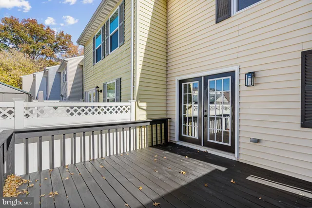 a view of a wooden deck with a yard