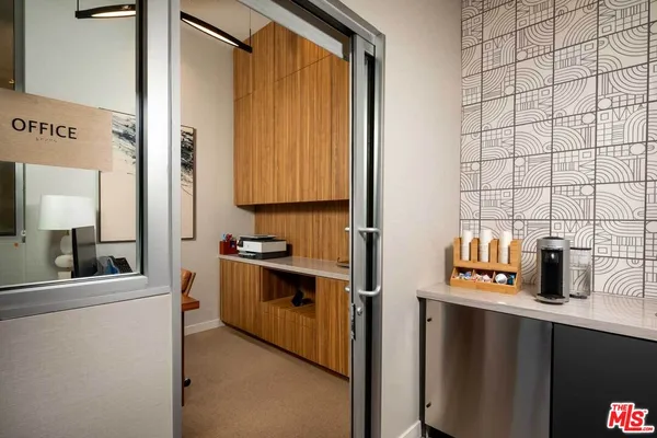 a kitchen with stainless steel appliances a sink and cabinets