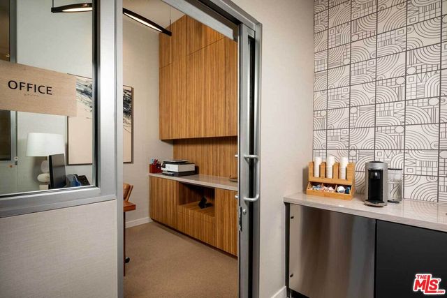 a kitchen with stainless steel appliances a sink and cabinets