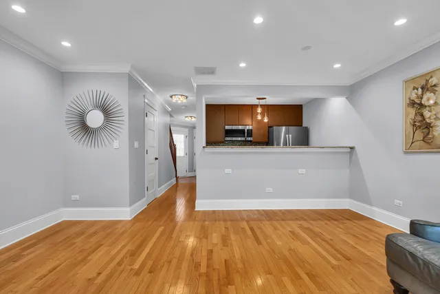 a view of a kitchen with a sink and microwave