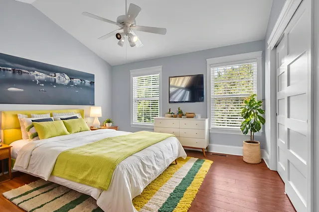 a bedroom with a bed and a couch