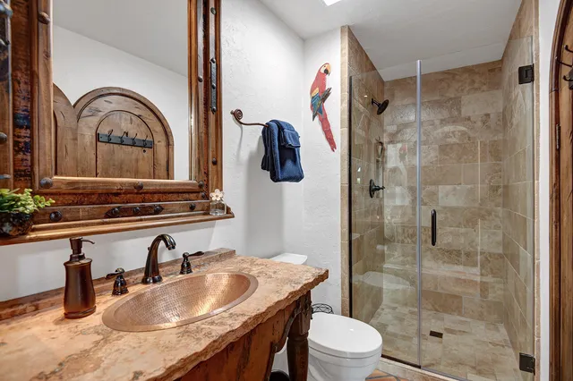 a view of a house with pool and chairs