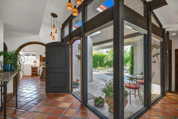 a kitchen with a sink and a large window