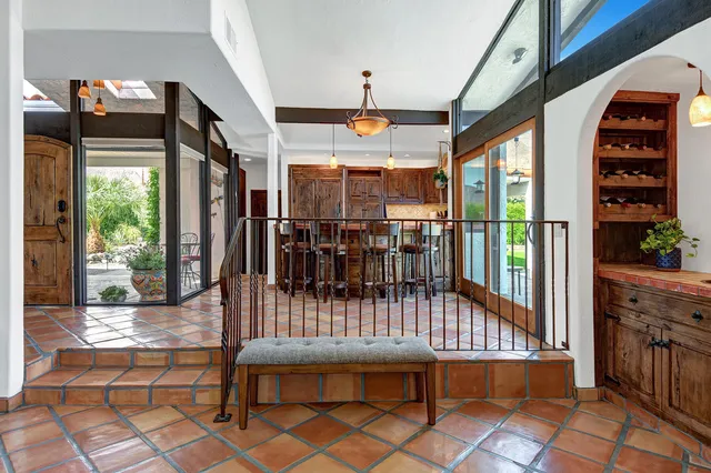 a dining room with furniture and lamp