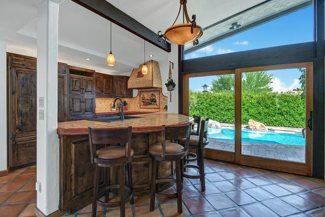 a kitchen with a sink cabinets and window