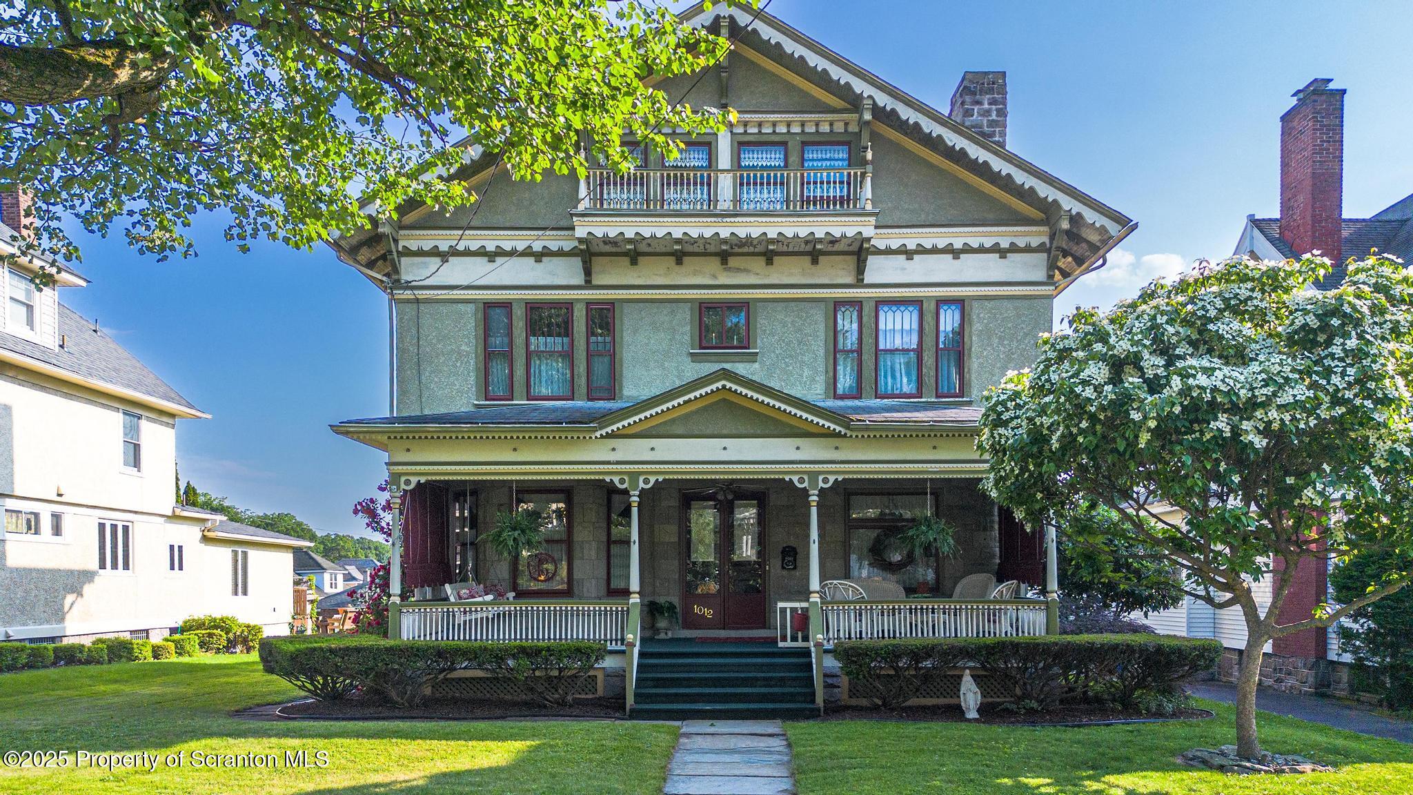 1012 Sunset Street Scranton, PA 18509 - Photo 1 of 46 a front view of a house with garden