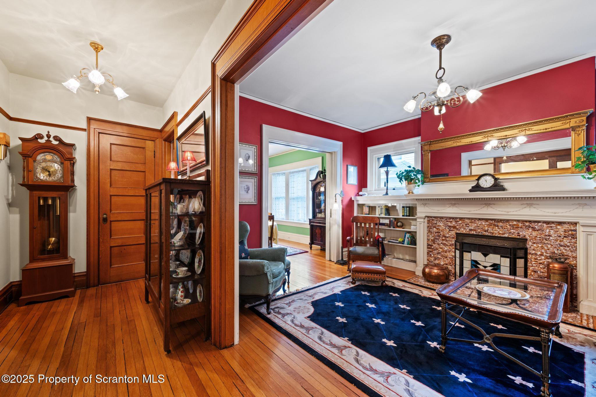 1012 Sunset Street Scranton, PA 18509 - Photo 11 of 46 a living room with furniture and a fireplace