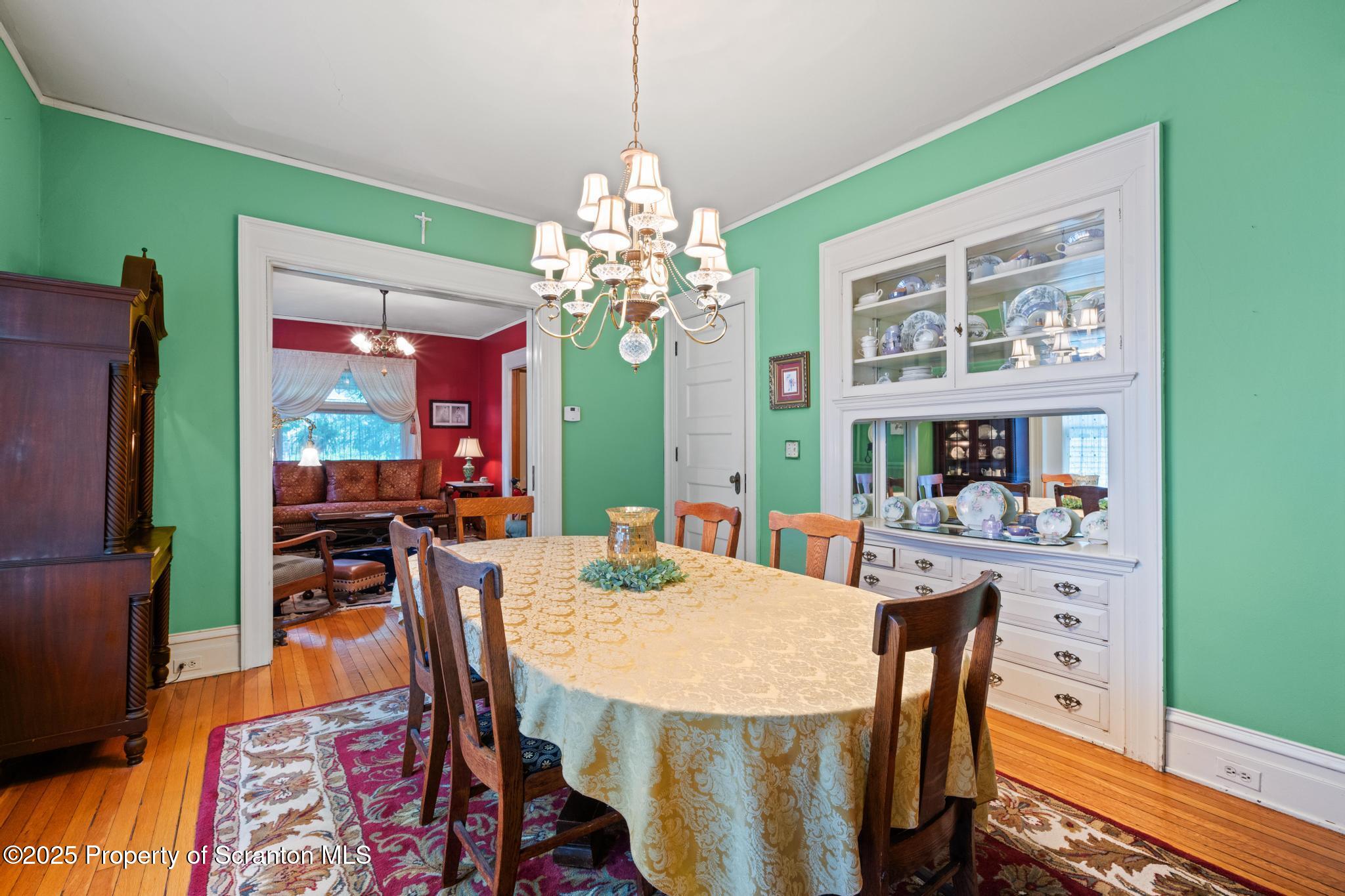 1012 Sunset Street Scranton, PA 18509 - Photo 14 of 46 a view of a dining room with furniture and a chandelier