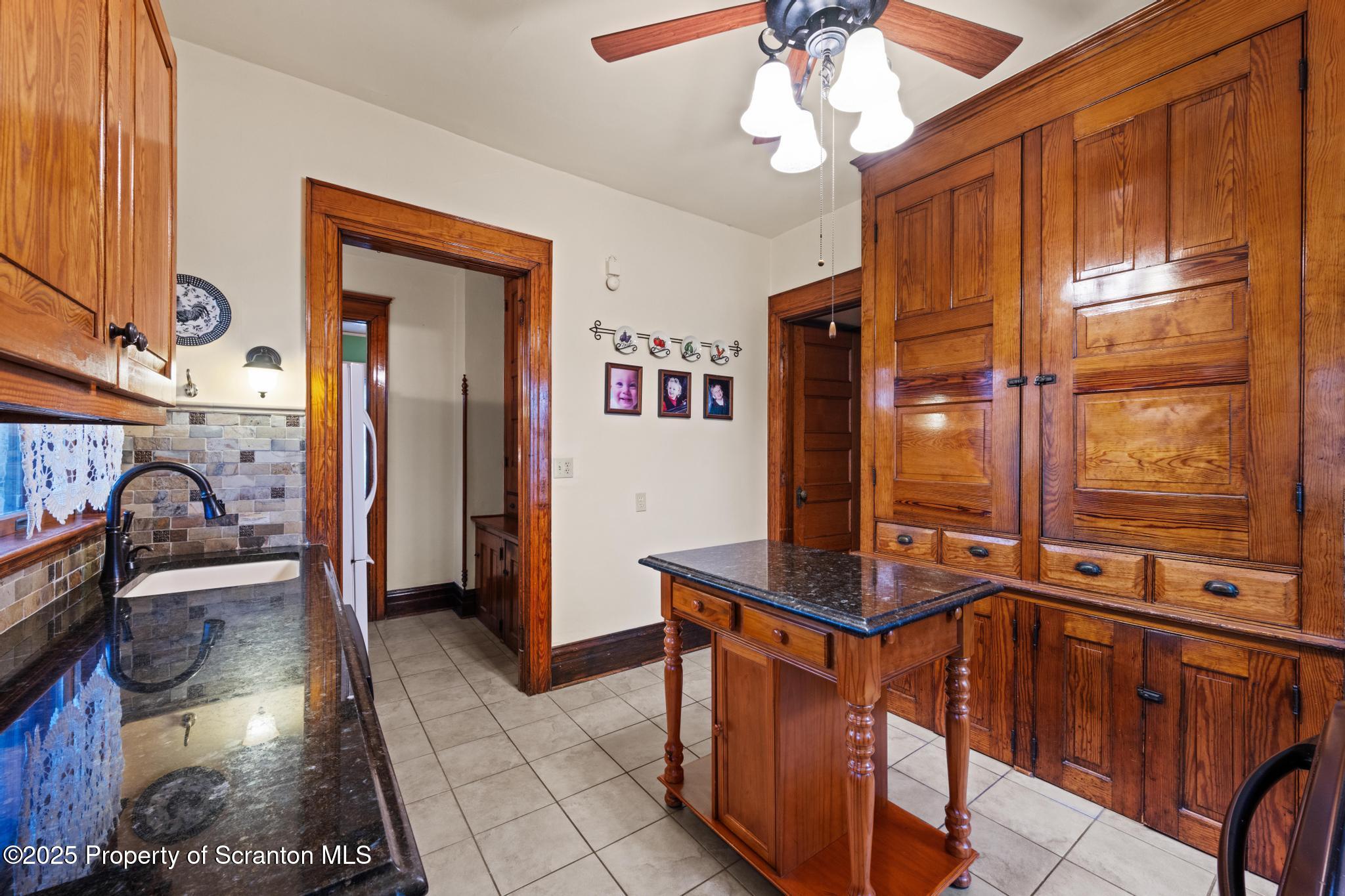 1012 Sunset Street Scranton, PA 18509 - Photo 16 of 46 a view of a hallway with furniture and chandelier