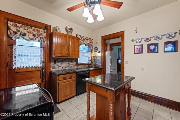 a kitchen with stainless steel appliances granite countertop a stove and a sink