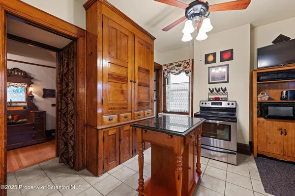a kitchen with stainless steel appliances granite countertop a stove and a sink
