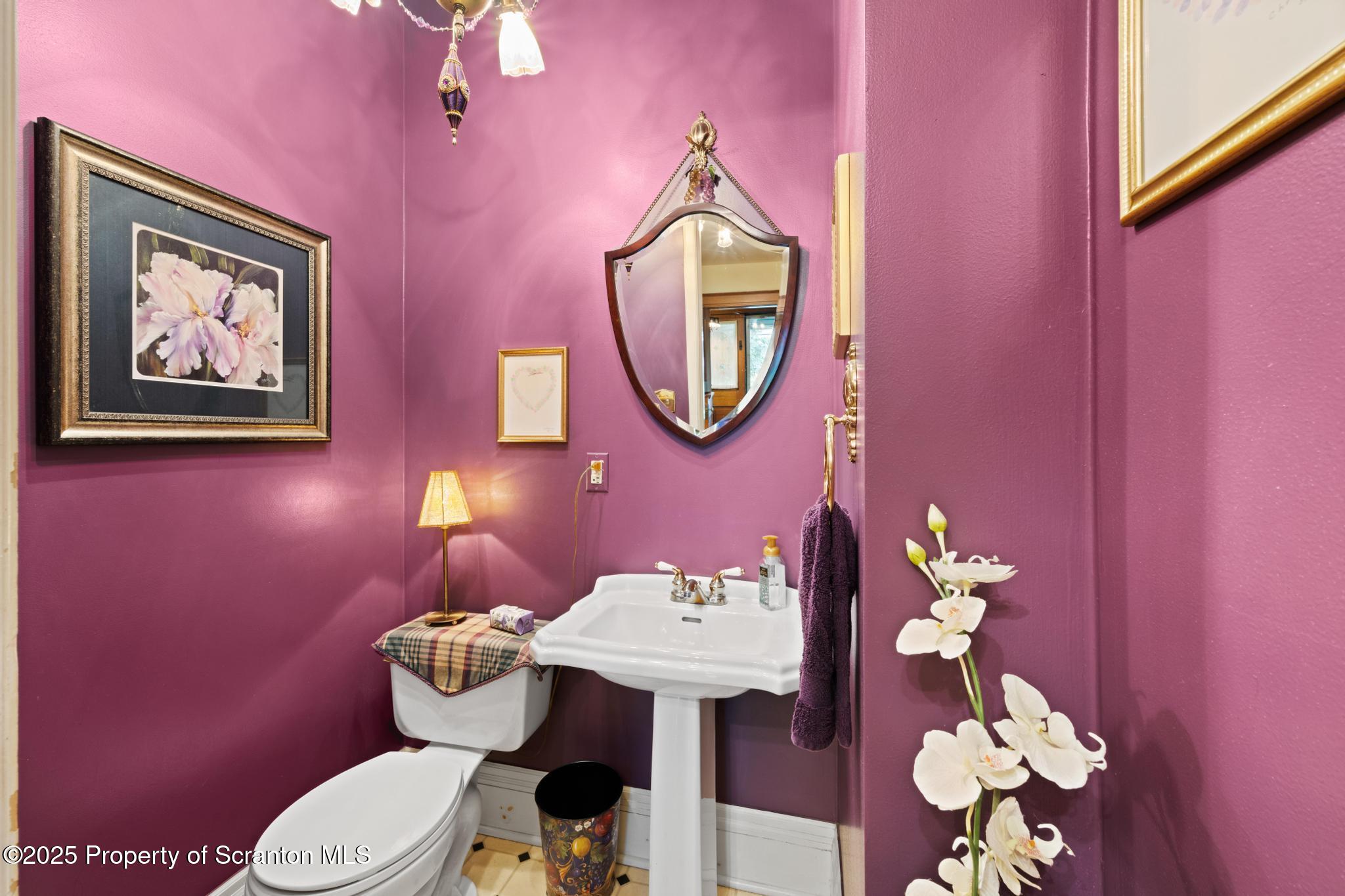 1012 Sunset Street Scranton, PA 18509 - Photo 20 of 46 a bathroom with a toilet a sink and a mirror