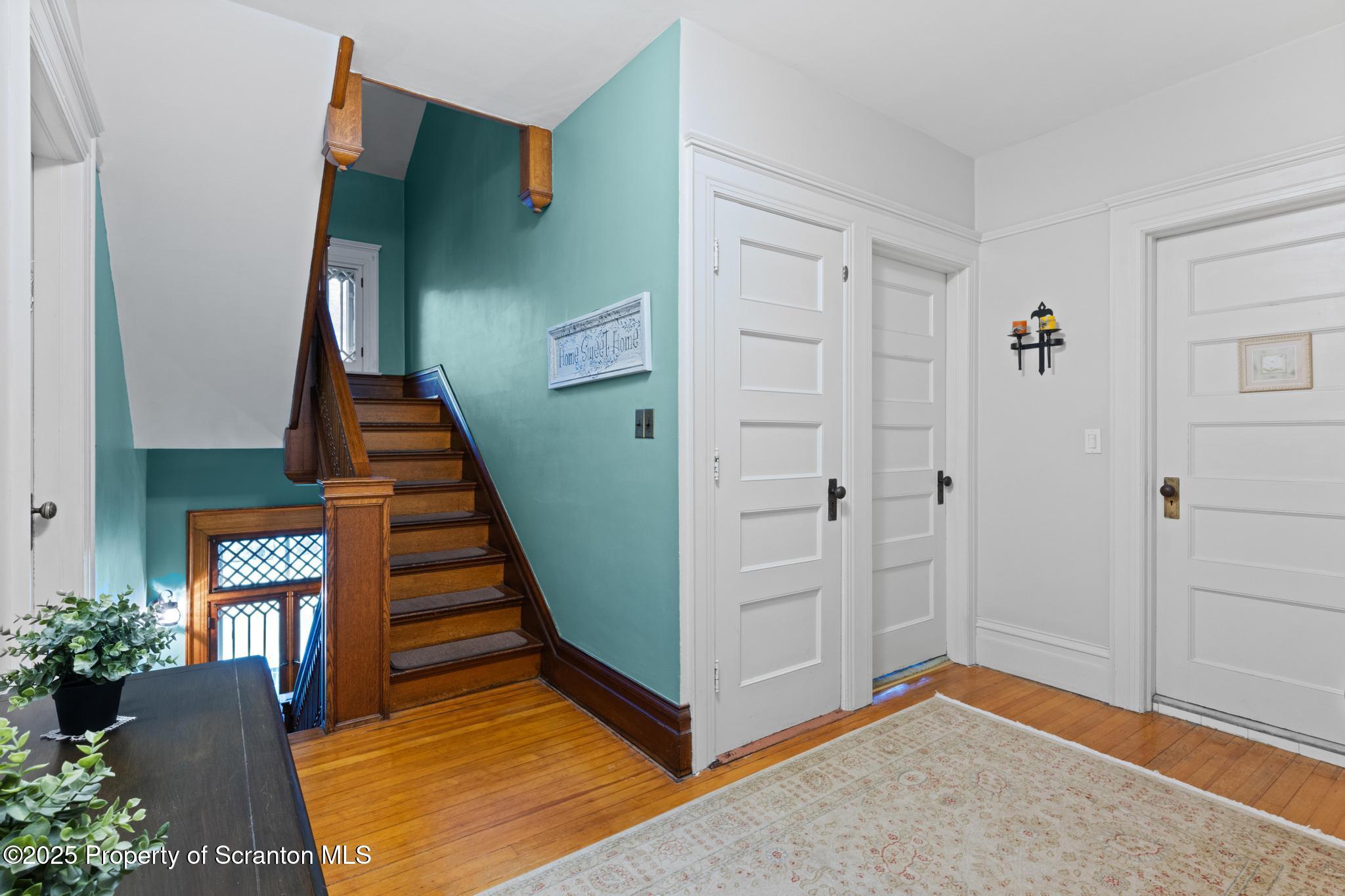 1012 Sunset Street Scranton, PA 18509 - Photo 21 of 46 a view of entryway with wooden floor and stairs