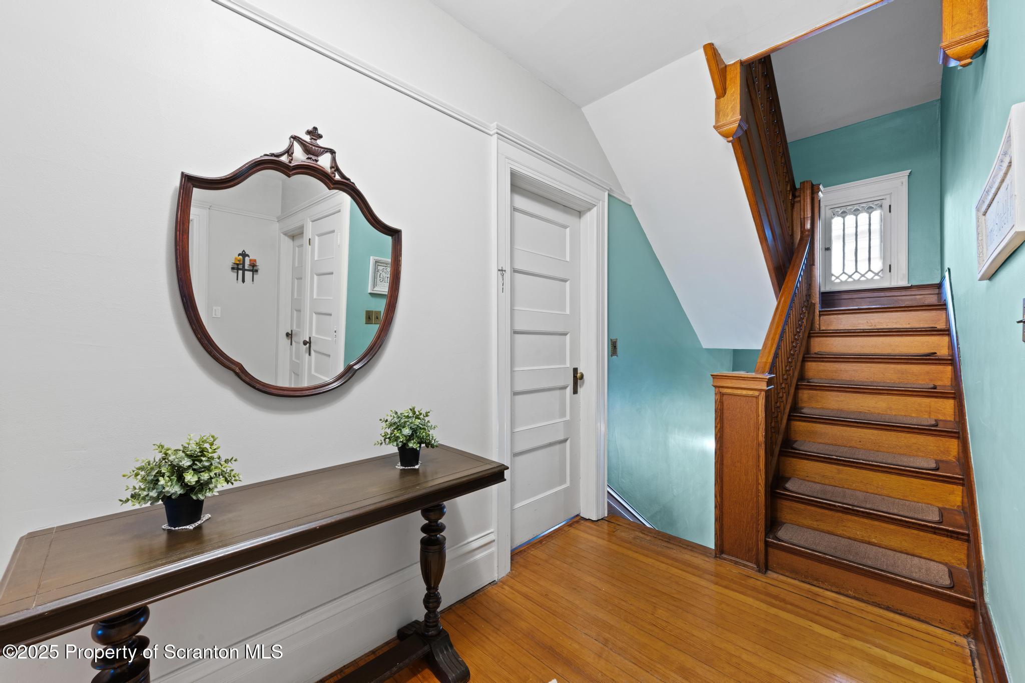 1012 Sunset Street Scranton, PA 18509 - Photo 22 of 46 a view of a hallway with wooden floor and entryway