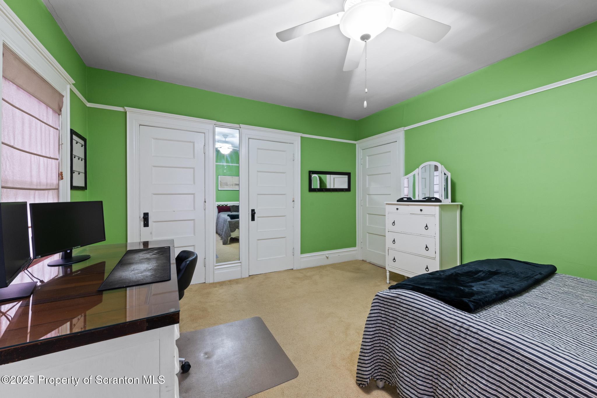 1012 Sunset Street Scranton, PA 18509 - Photo 24 of 46 a bedroom with a bed furniture and a flat screen tv