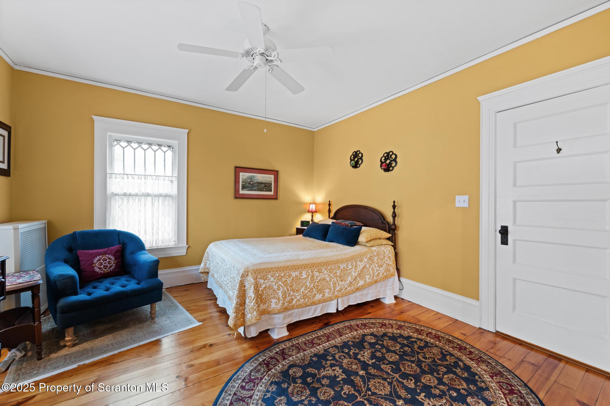 1012 Sunset Street Scranton, PA 18509 - Photo 32 of 46 a bedroom with bed chair and window