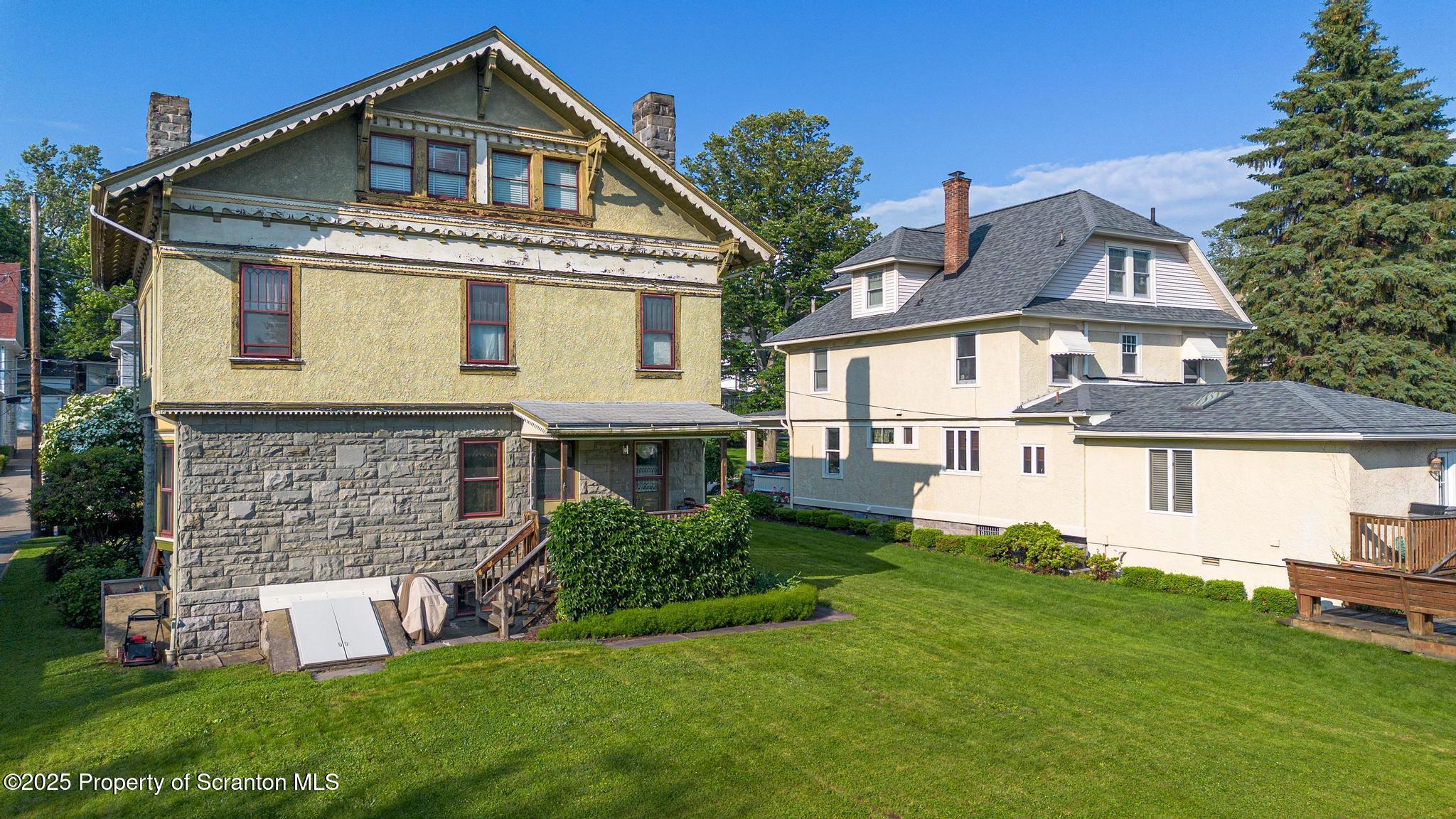 1012 Sunset Street Scranton, PA 18509 - Photo 40 of 46 a front view of a house with a yard