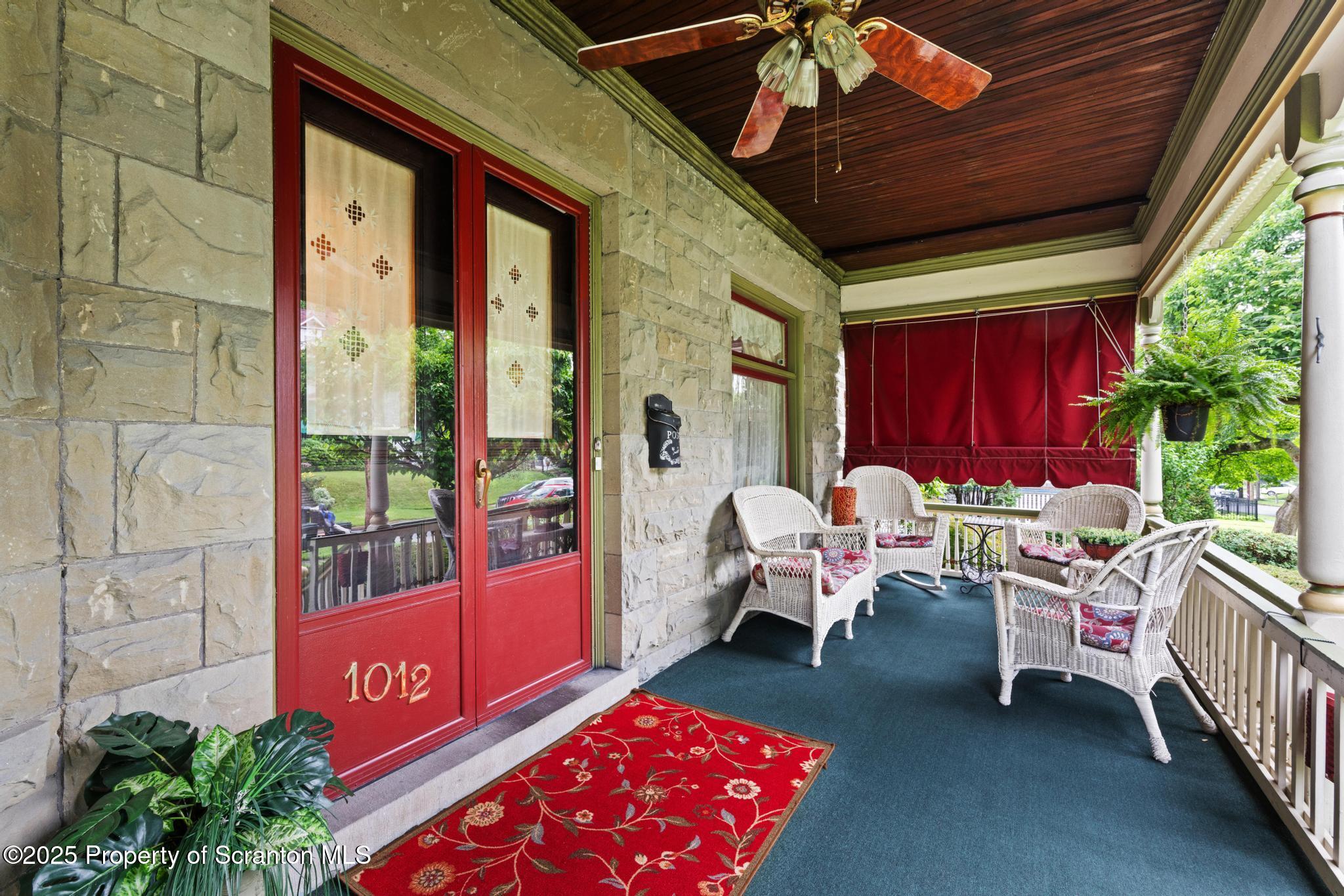 1012 Sunset Street Scranton, PA 18509 - Photo 4 of 46 a balcony filled with furniture and rug
