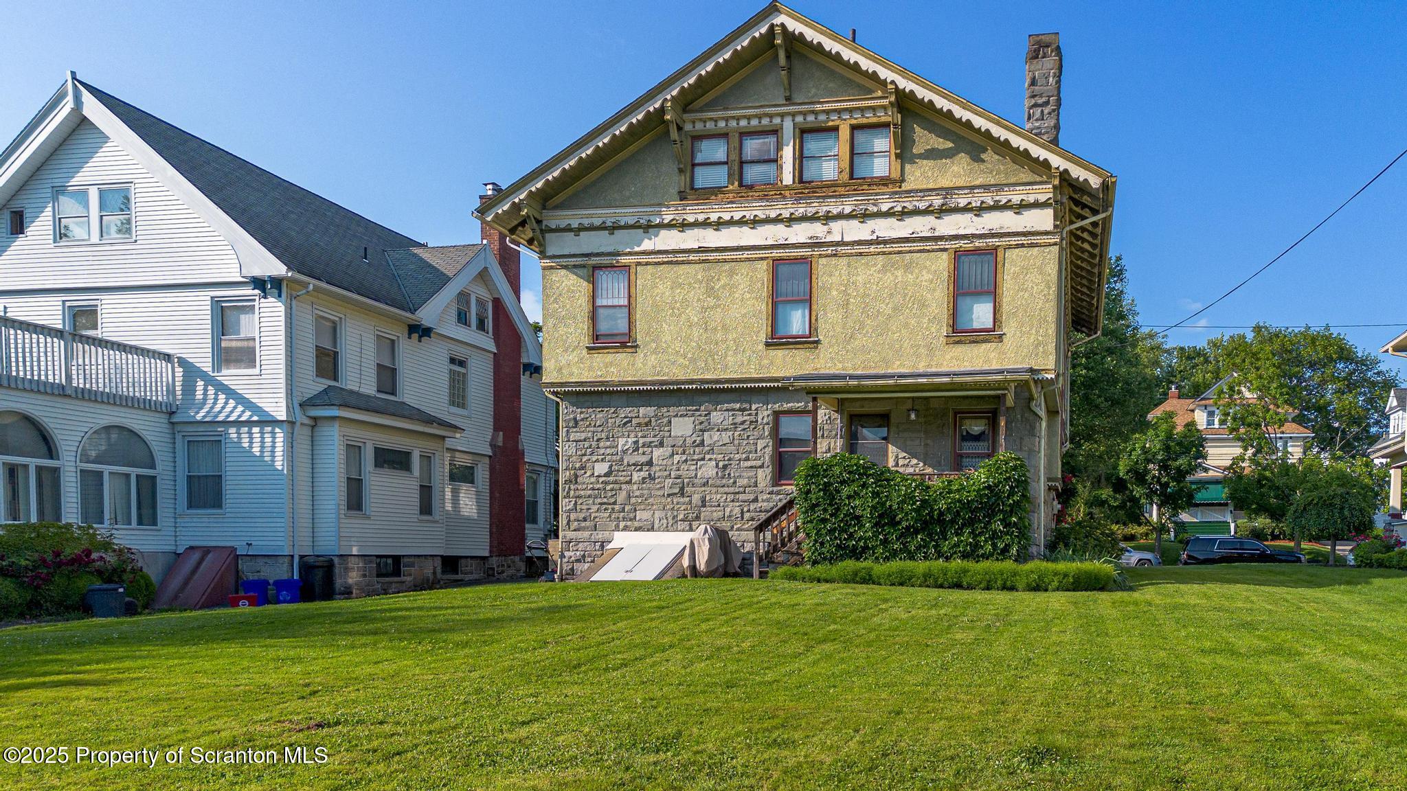 1012 Sunset Street Scranton, PA 18509 - Photo 42 of 46 a front view of a house with a yard