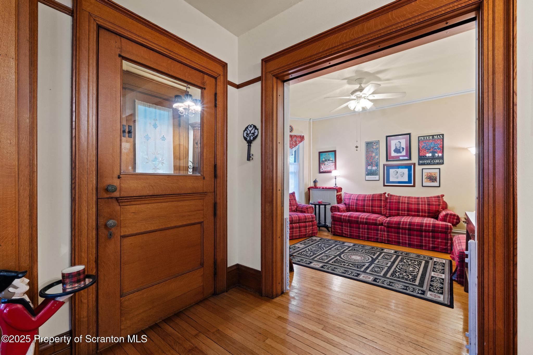 1012 Sunset Street Scranton, PA 18509 - Photo 6 of 46 a view of living room with furniture and wooden floor
