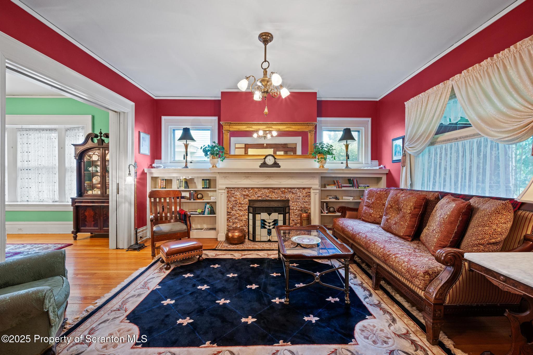 1012 Sunset Street Scranton, PA 18509 - Photo 9 of 46 a living room with furniture and a fireplace
