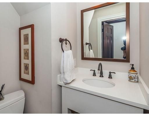 a bathroom with a sink vanity and a mirror