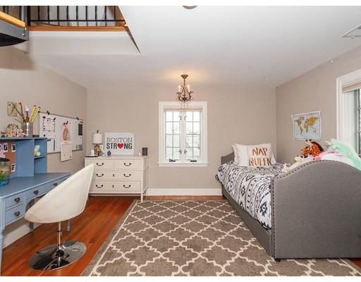 a bed room with a bed window and a dresser