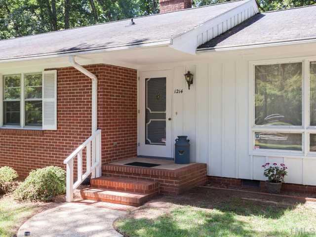 1214 Lorimer Road Raleigh, NC 27606 - Photo 3 of 25 a front view of a house with a yard