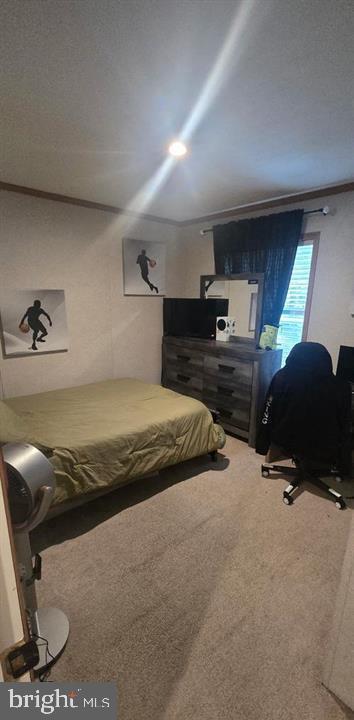 2110 Mays Landing Road, Unit 73 Millville, NJ 08332 - Photo 5 of 11 a bedroom with a bed and a chair in it