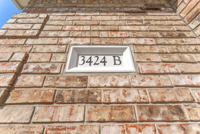 a close up of a street sign on a wall