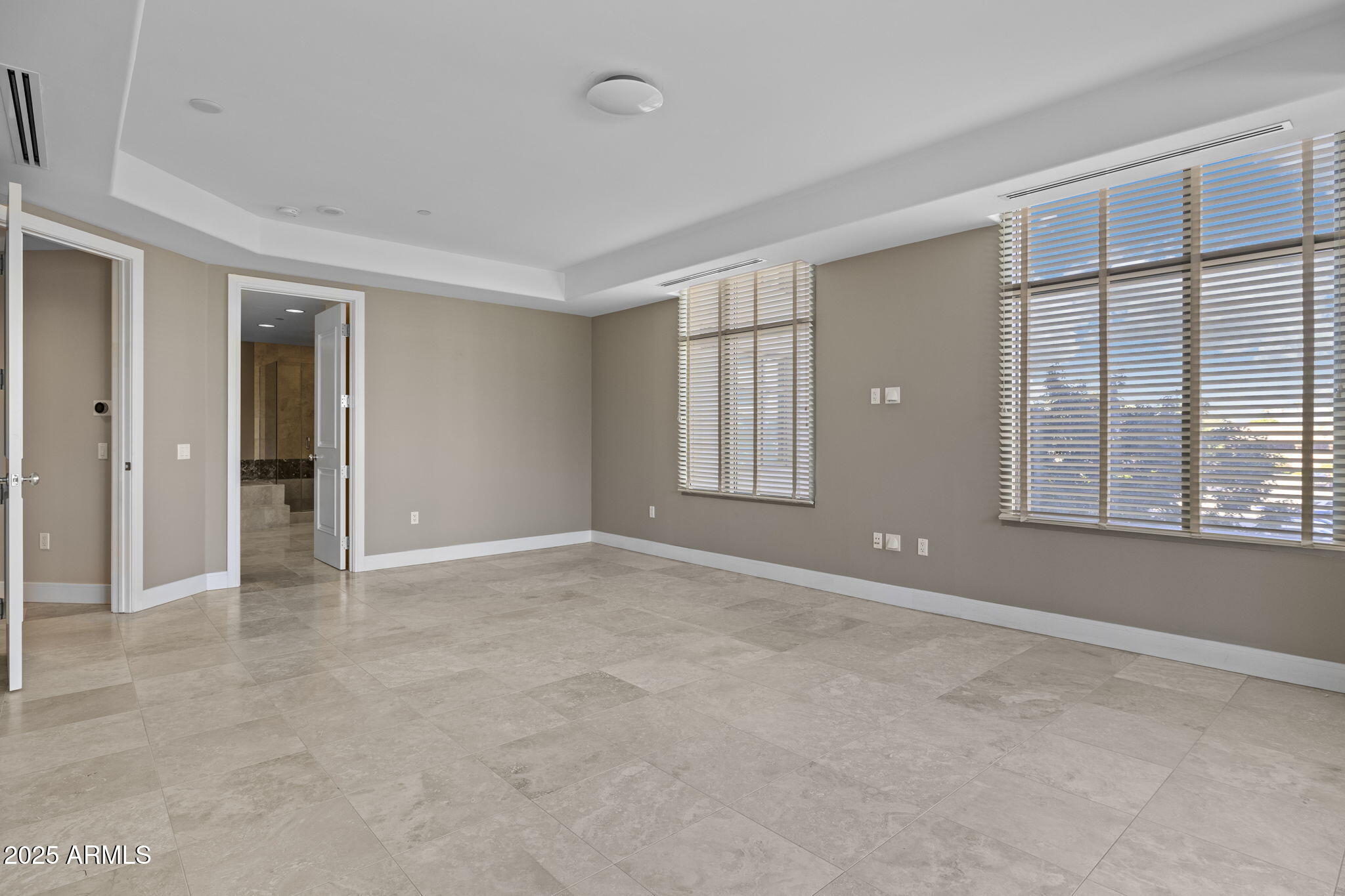 2211 East Camelback Road, Unit 201 Phoenix, AZ 85016 - Photo 18 of 42 a view of an empty room with windows