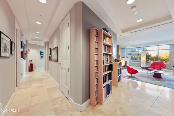 a kitchen with granite countertop white cabinets and stainless steel appliances