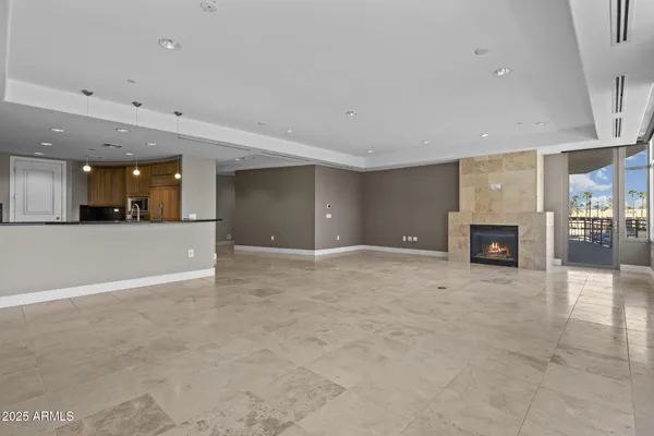 a view of an empty room with windows