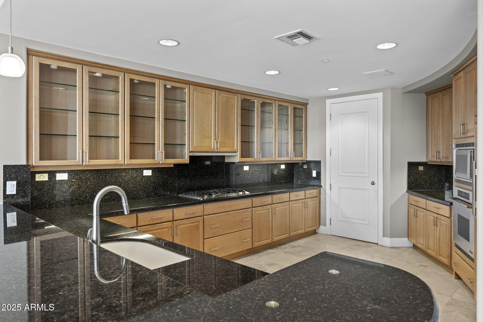 2211 East Camelback Road, Unit 201 Phoenix, AZ 85016 - Photo 10 of 42 a kitchen with a sink and a stove top oven