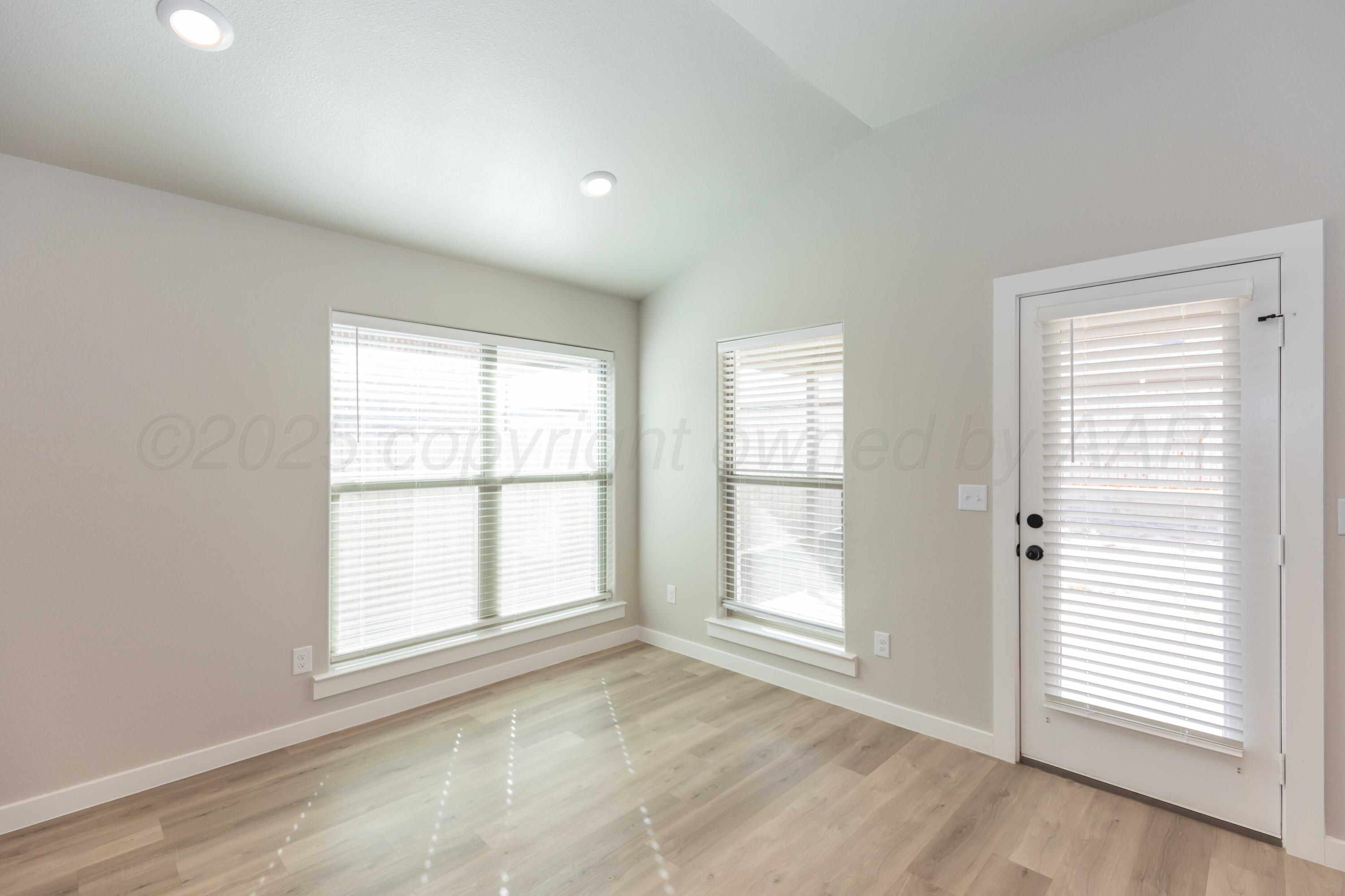 1801 Moon River Road Amarillo, TX 79118 - Photo 13 of 43 an empty room with windows
