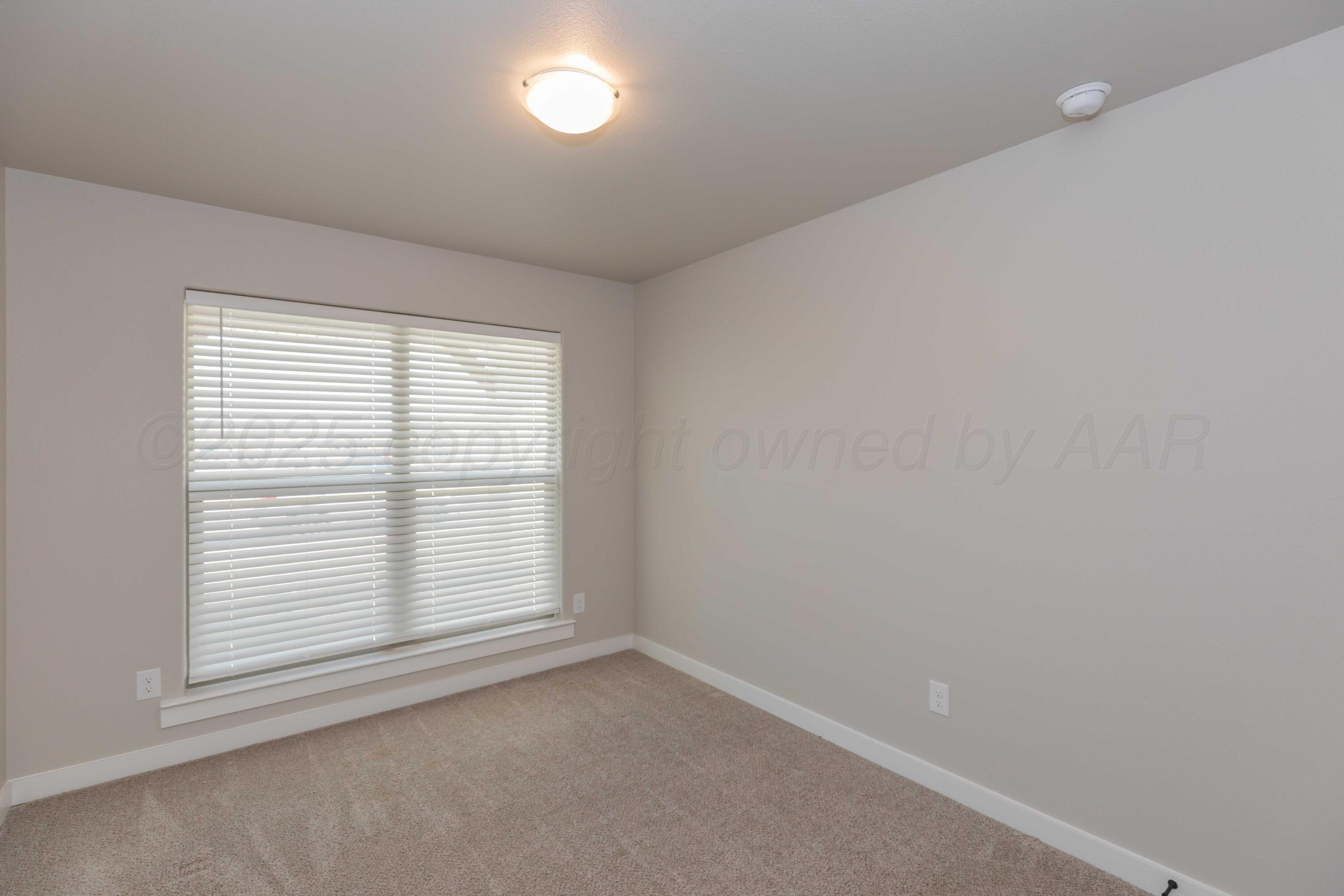 1801 Moon River Road Amarillo, TX 79118 - Photo 14 of 43 an empty room with a window