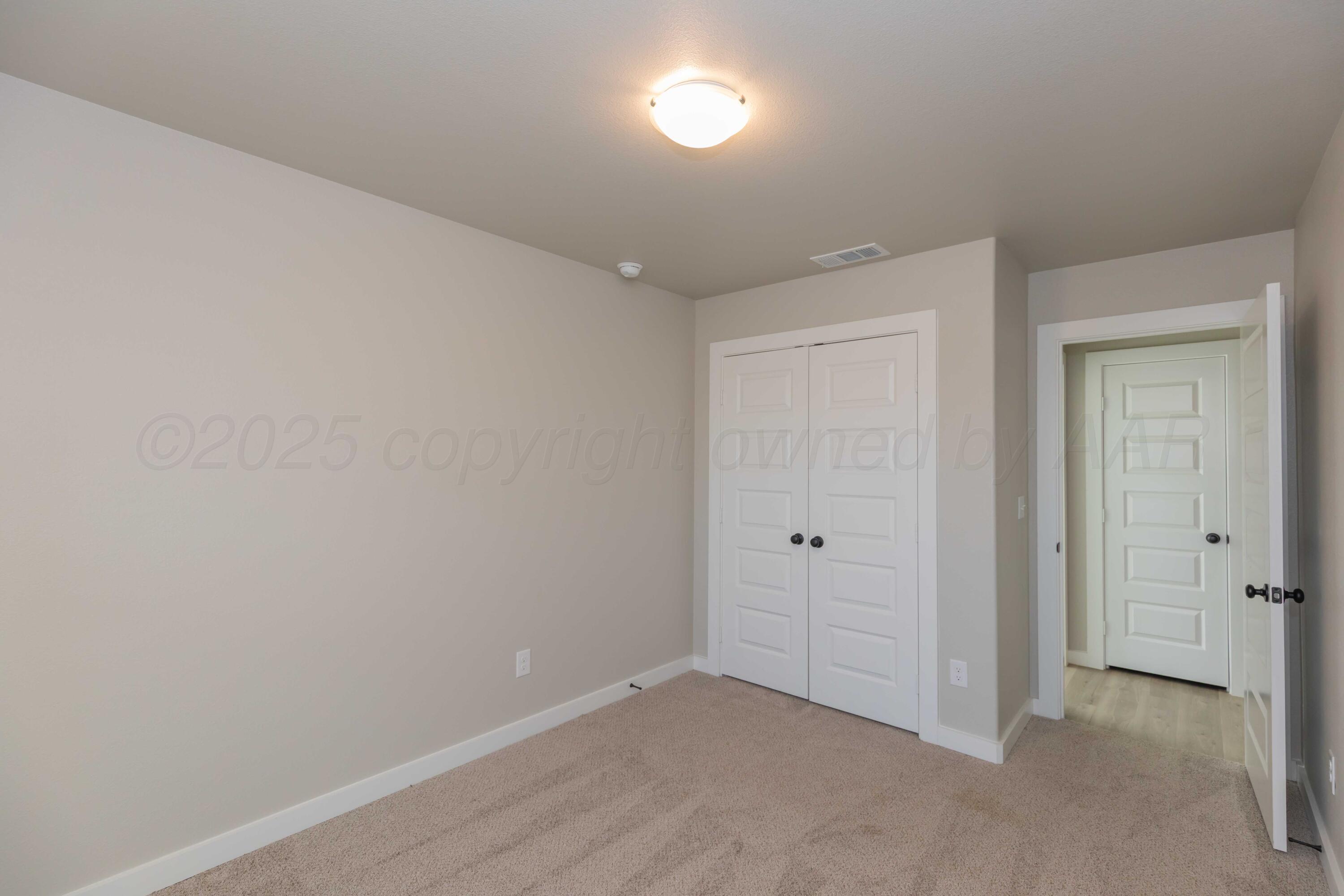 1801 Moon River Road Amarillo, TX 79118 - Photo 15 of 43 wooden floor in an empty room