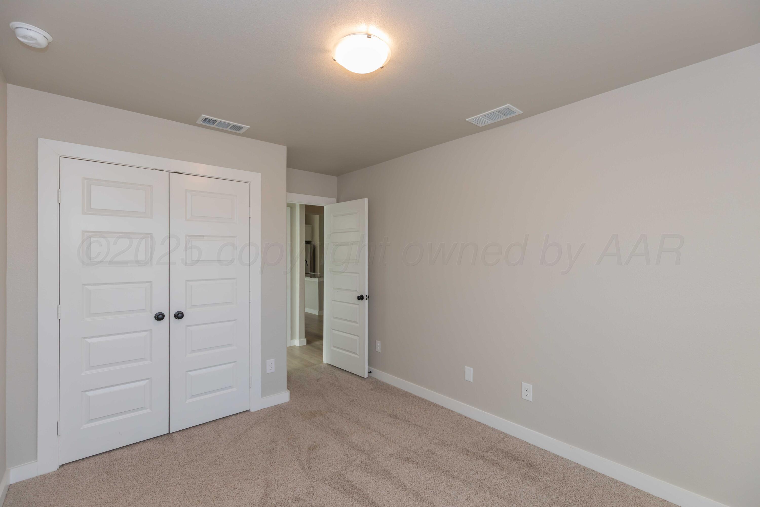 1801 Moon River Road Amarillo, TX 79118 - Photo 16 of 43 wooden floor in an empty room