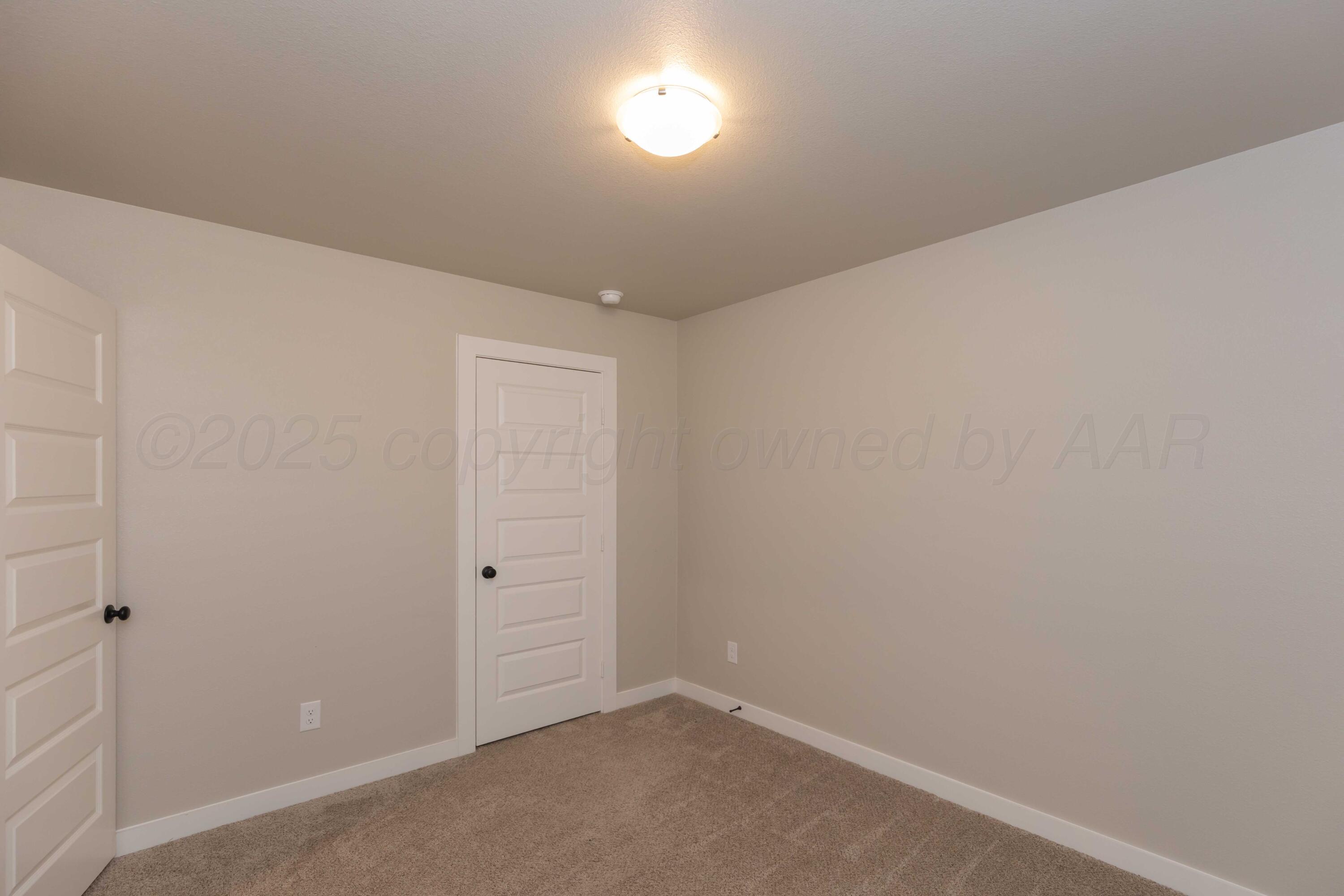 1801 Moon River Road Amarillo, TX 79118 - Photo 21 of 43 an empty room with an entryway