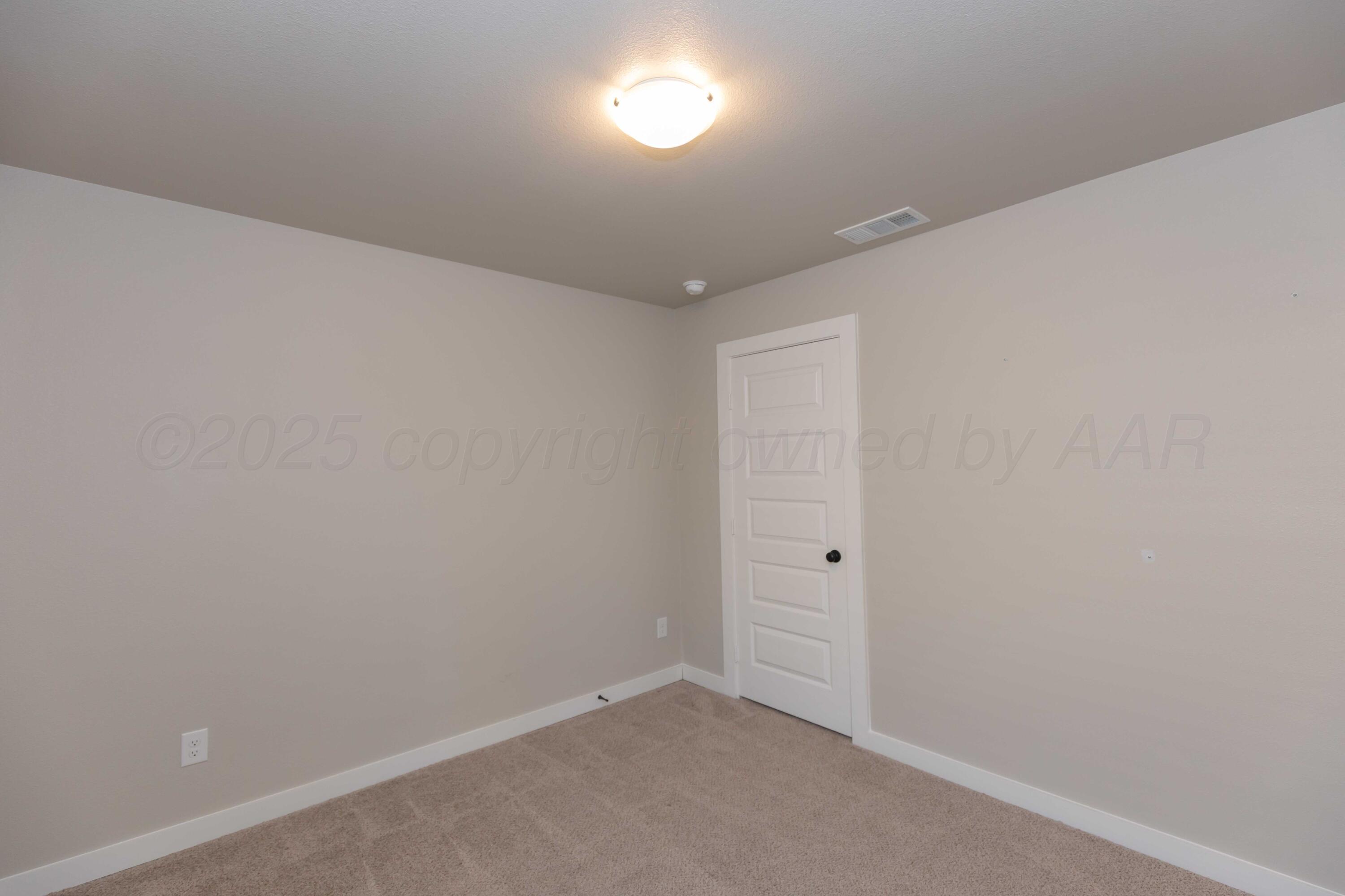 1801 Moon River Road Amarillo, TX 79118 - Photo 28 of 43 an empty room with an entryway