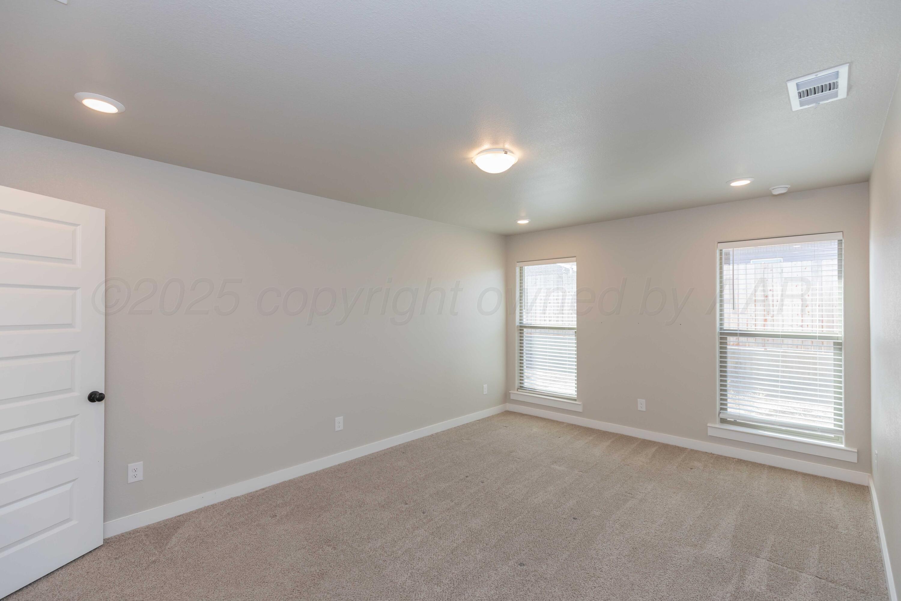 1801 Moon River Road Amarillo, TX 79118 - Photo 29 of 43 an empty room with windows