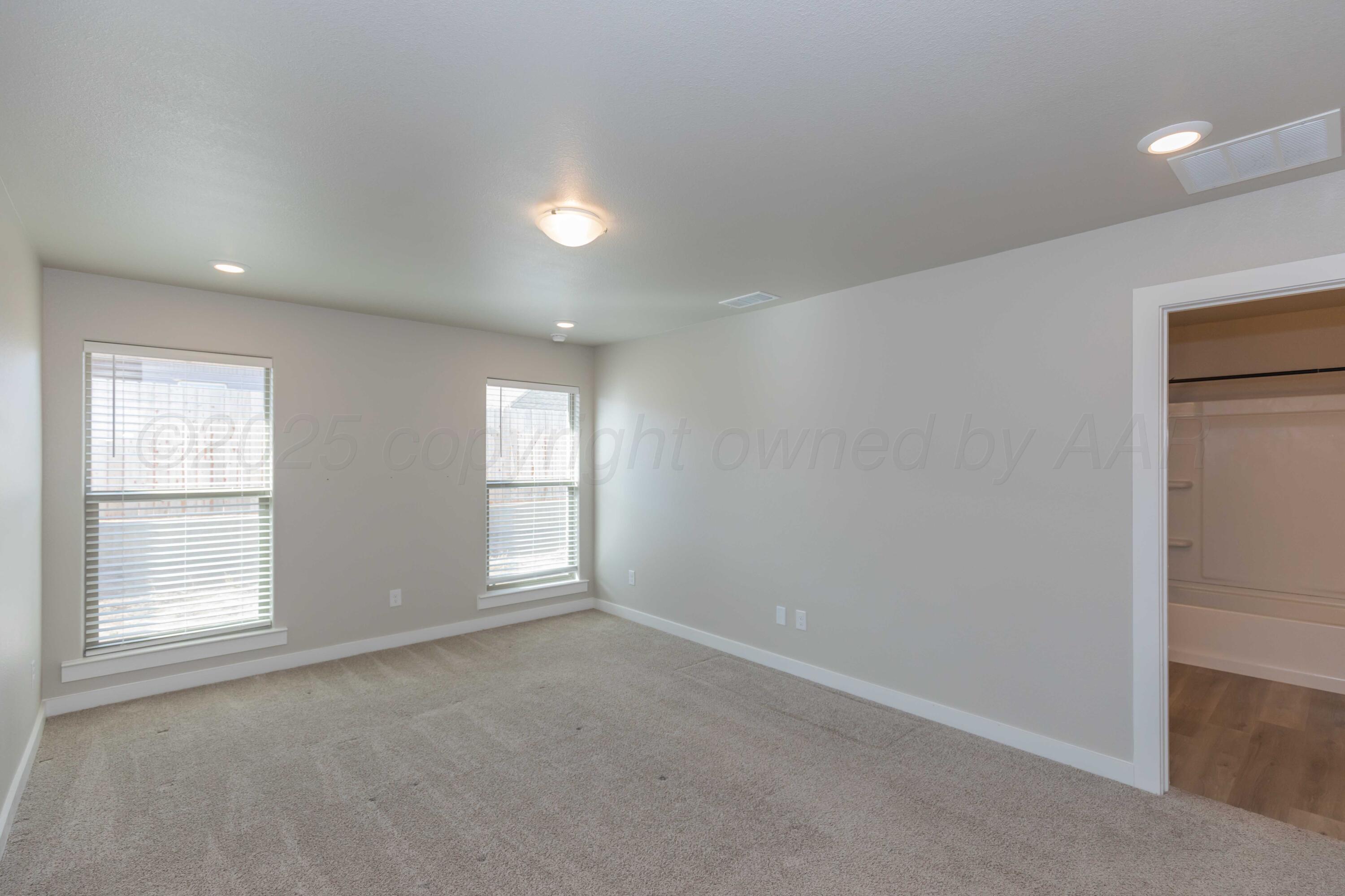 1801 Moon River Road Amarillo, TX 79118 - Photo 32 of 43 a view of empty room with windows