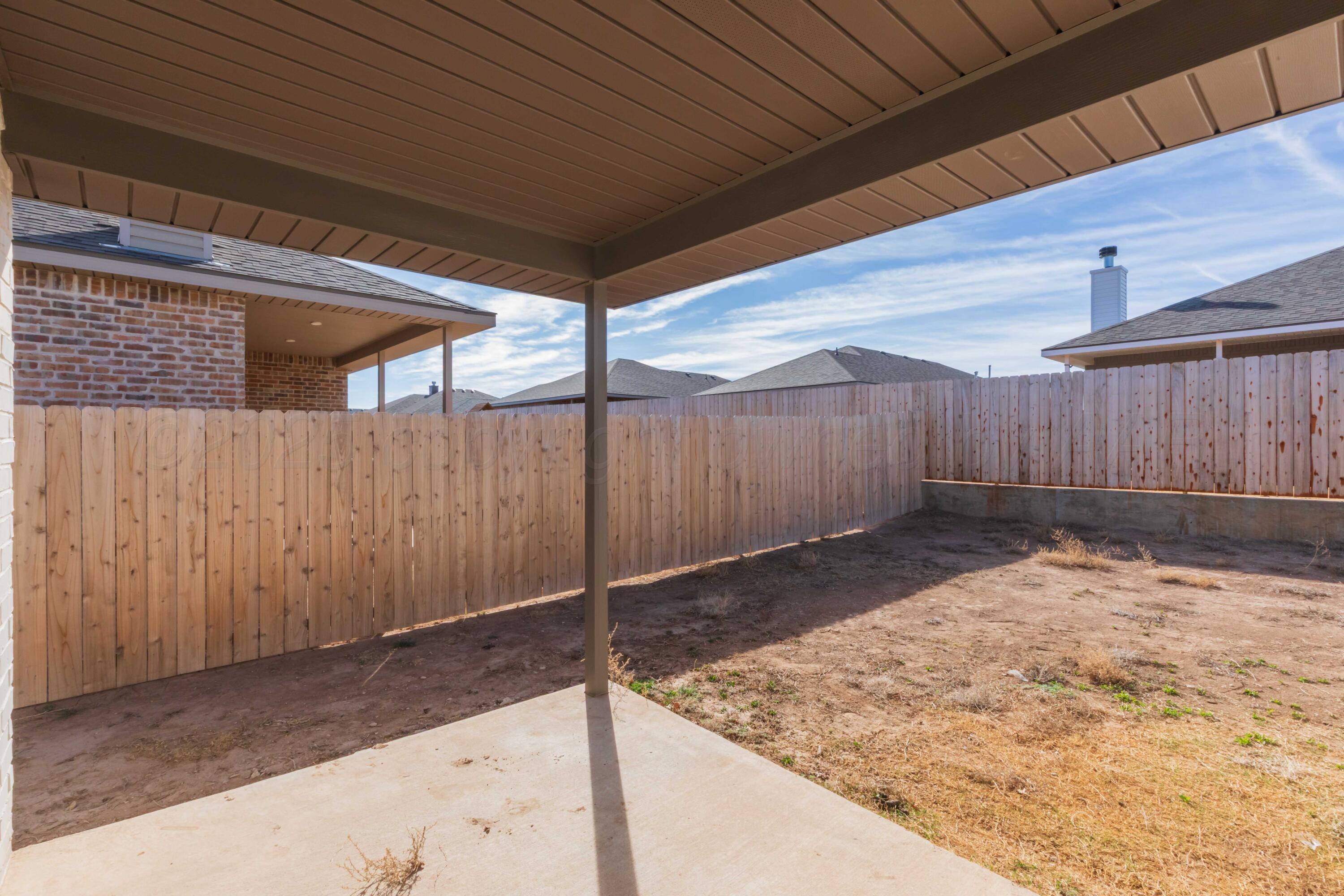 1801 Moon River Road Amarillo, TX 79118 - Photo 42 of 43 a view of a backyard
