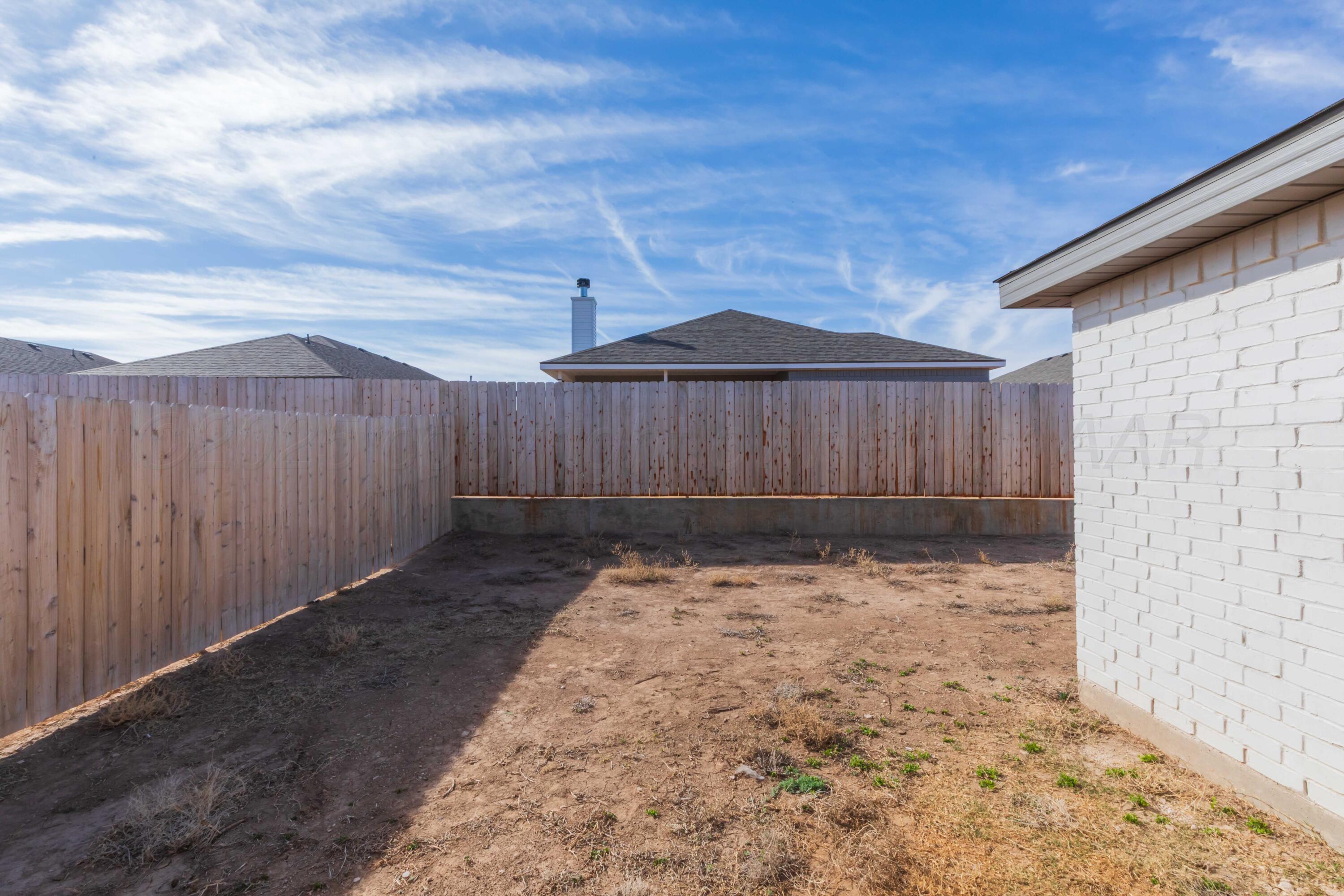 1801 Moon River Road Amarillo, TX 79118 - Photo 43 of 43 a backyard of a house