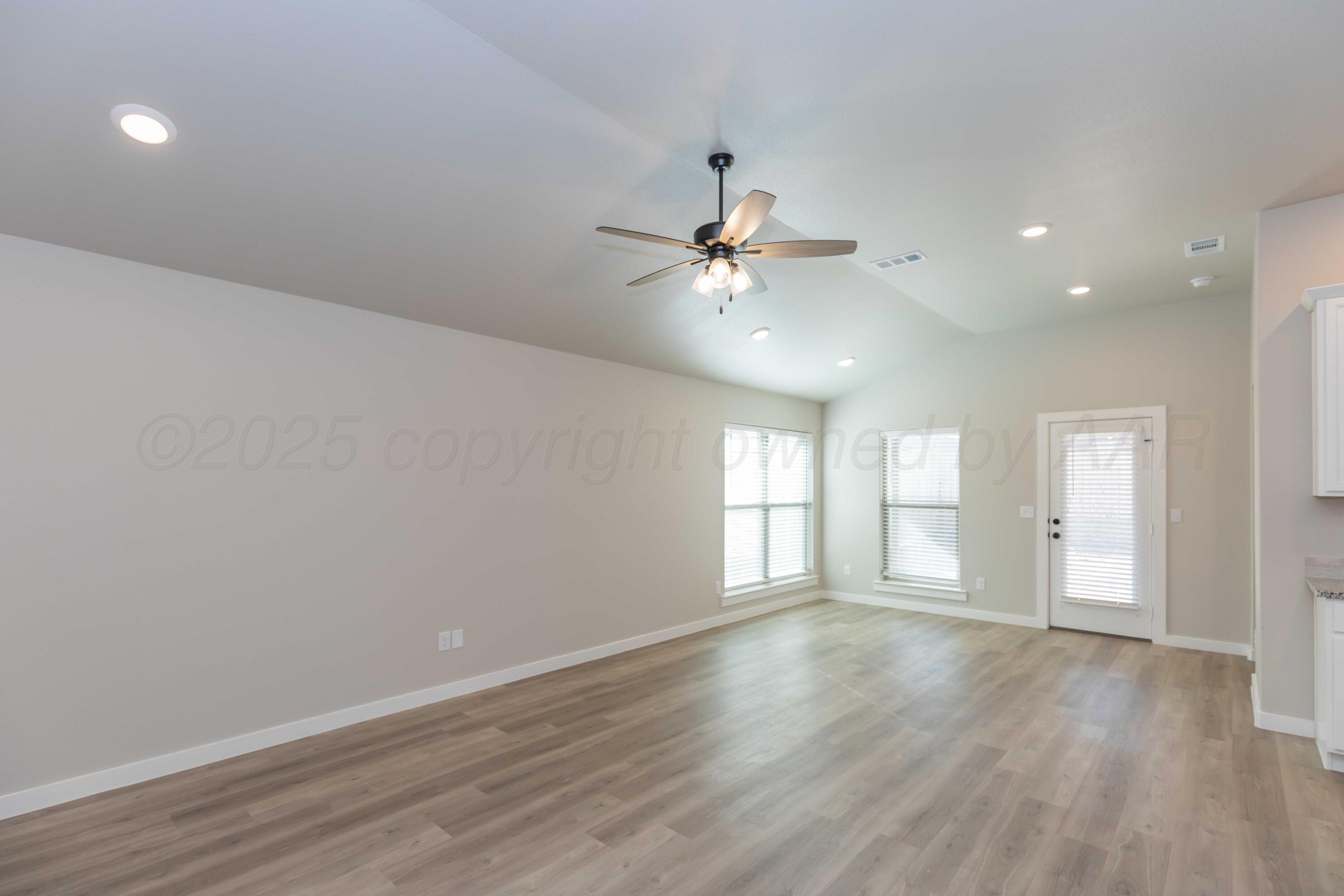 1801 Moon River Road Amarillo, TX 79118 - Photo 5 of 43 a view of an empty room with a window