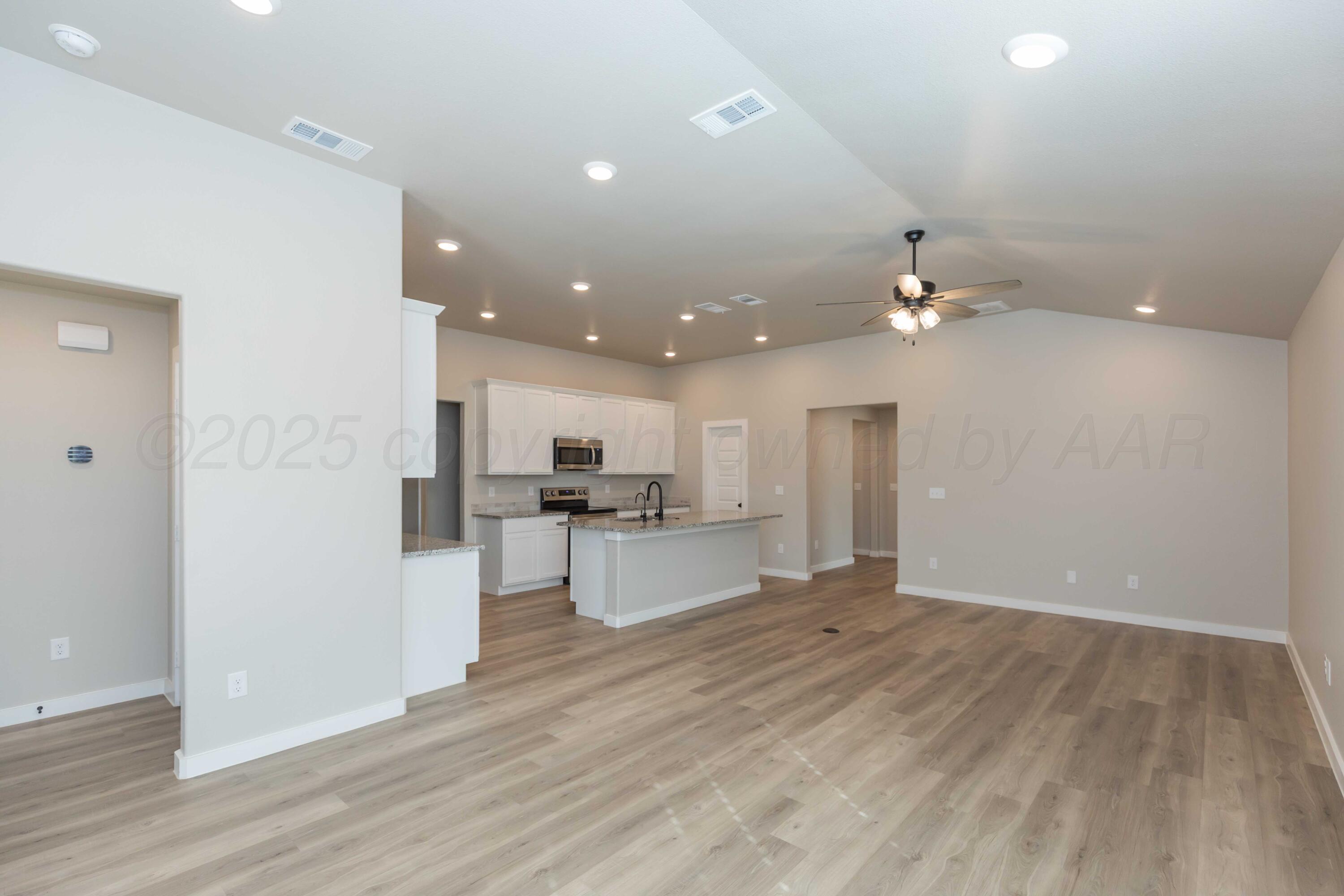 1801 Moon River Road Amarillo, TX 79118 - Photo 8 of 43 a view of kitchen with microwave and refrigerator