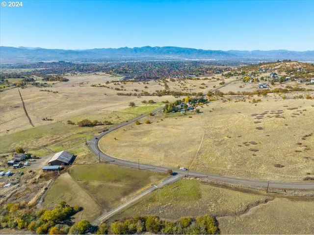 a view of a mountain with an ocean beach