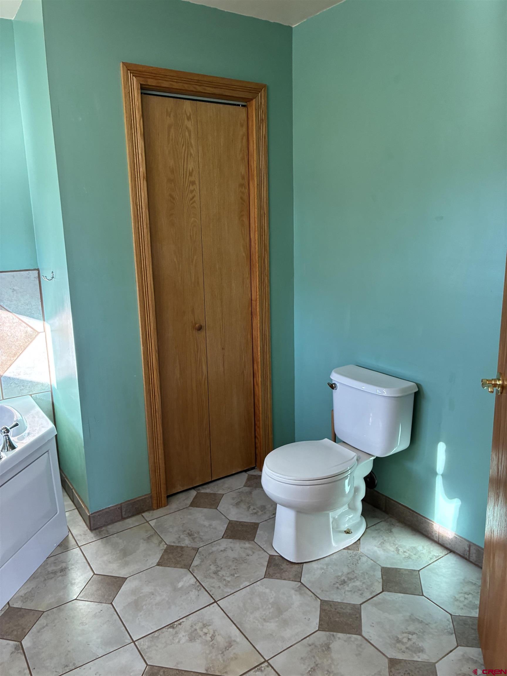 15334 County Rd T.5 La Jara, CO 81140 - Photo 18 of 28 a bathroom with a toilet and a sink