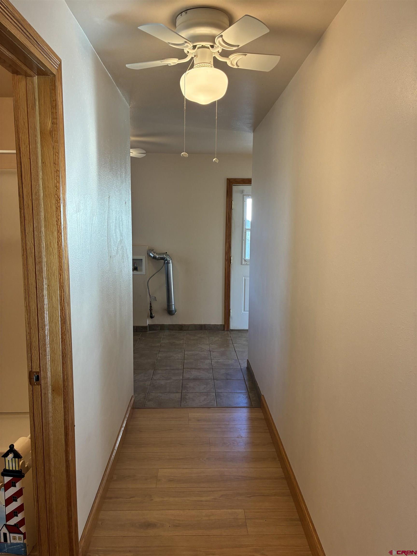15334 County Rd T.5 La Jara, CO 81140 - Photo 21 of 28 a view of a hallway with wooden floor