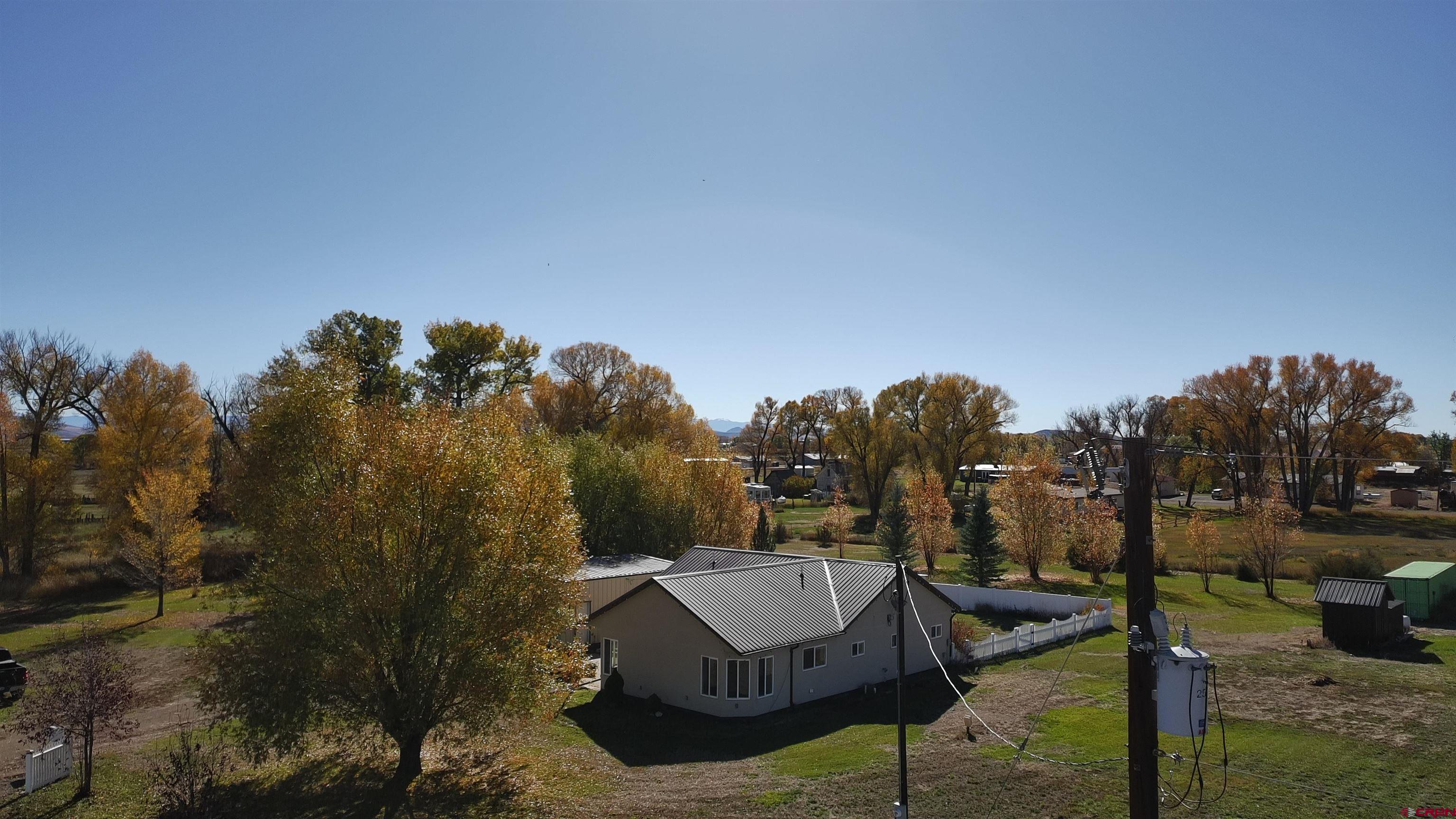 15334 County Rd T.5 La Jara, CO 81140 - Photo 3 of 28 a view of a house with backyard and sitting area